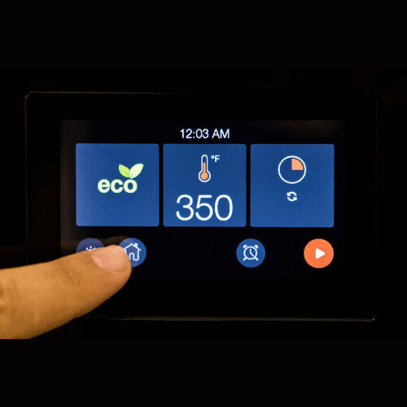 A person's finger pushing a button on the TFT display's touch screen.