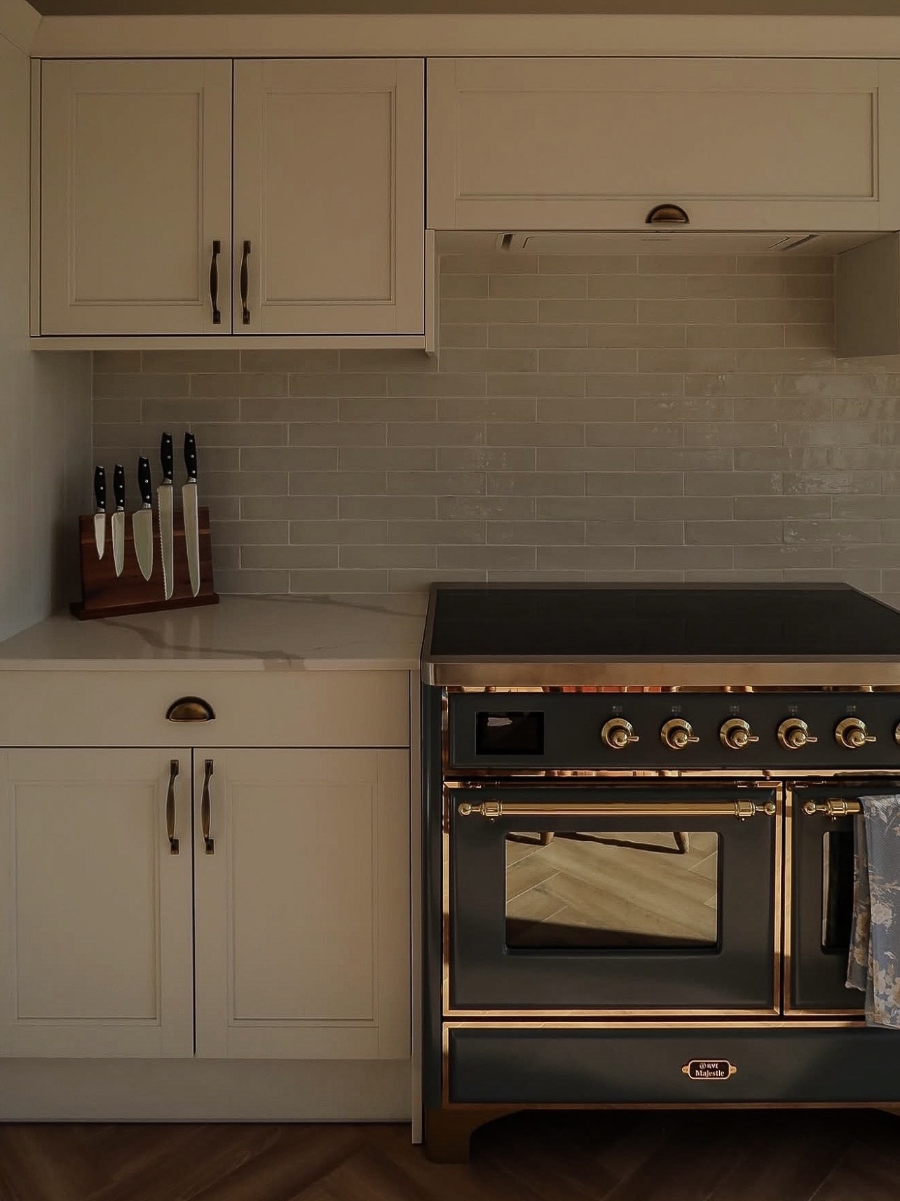 Warm lighting highlighting ILVE range and kitchen