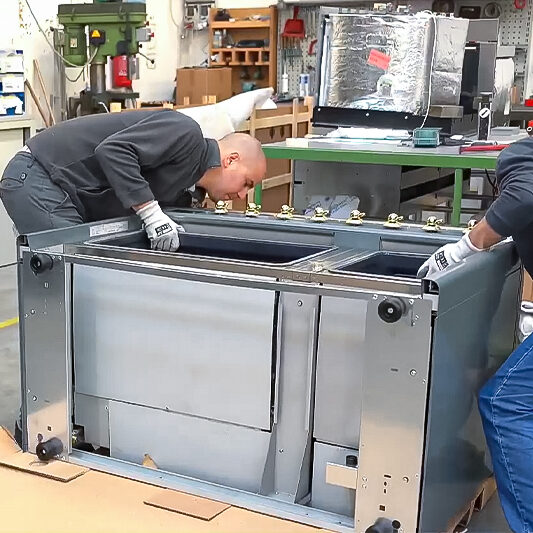 Two people showing how to install ILVE Majestic