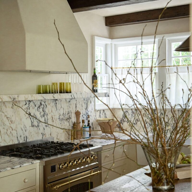 Carthay Square kitchen renovation with antique island, marble backsplash, and ILVE range