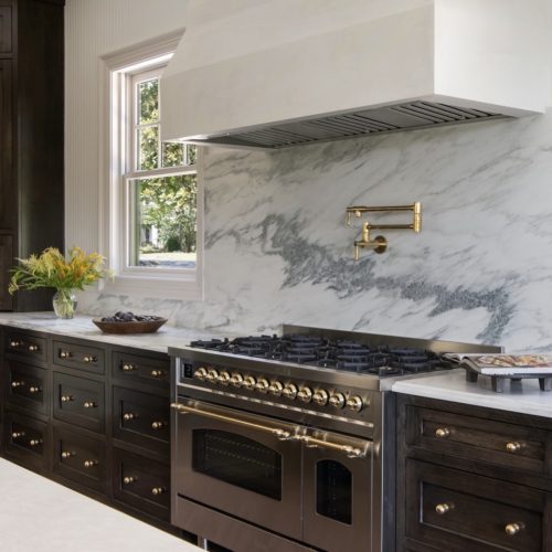 Modern kitchen layout highlighting how the range anchors cabinetry and surrounding space