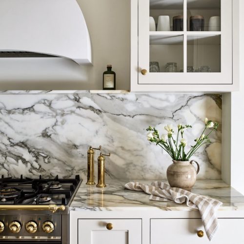 Finished luxury kitchen showcasing a range as the defining centerpiece of the space